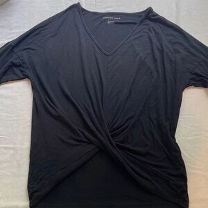 Long sleeve black flowy shirt with unique waistline